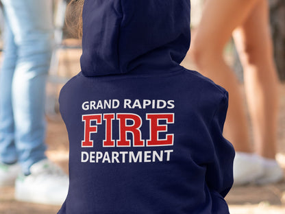 Back view of a child in a navy blue hoodie with the hood up and custom fire department name in white text, "FIRE" in red with a white outline and Department in white.