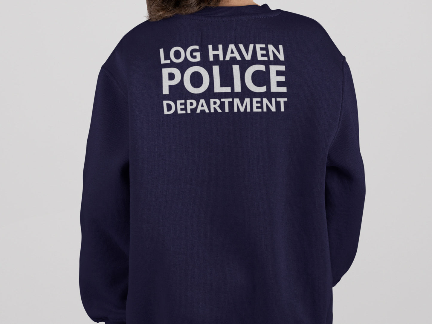 A navy blue sweatshirt with the text 'LOG HAVEN POLICE DEPARTMENT' printed in silver on the back.