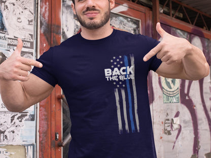A navy blue t-shirt with a white and blue American flag design. The flag has a thin blue line running down the center. The text 'Back the Blue' is printed in white on the t-shirt.