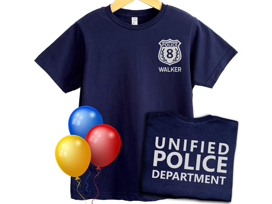 Navy blue t-shirt with silver police badge on left chest with the number 8 and the name 'WALKER' underneath in silver text. The shirt back has the text 'UNIFIED POLICE DEPARTMENT' in silver text.