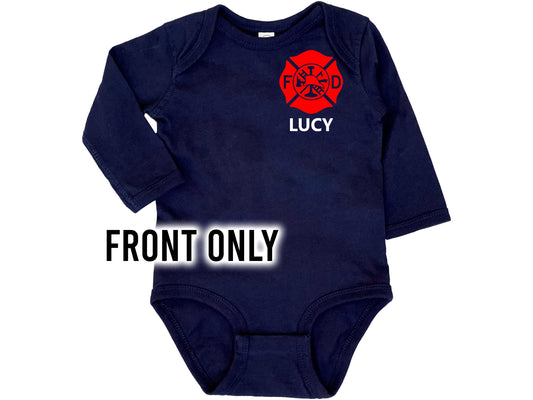Front view of navy blue long sleeve baby bodysuit with red mattresses cross on right shoulder with the name Lucy underneath.