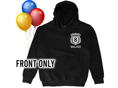 Black children's hoodie sweatshirt with silver police badge on the left chest. Badge includes the number 8, the word 'Police' above the number, and the word 'Name' below the badge in silver text.