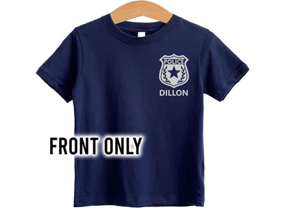 Front view of navy blue police kids t-shirt with silver police badge on left chest and child's name underneath.