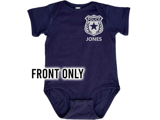 Front only view of navy blue short sleeve baby bodysuit with silver police badge and custom name underneath.