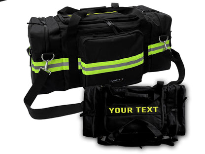 Black firefighter-style duffel bag with bright yellow and gray reflective stripes across the front and sides. The main image shows the bag with multiple zippered compartments, sturdy handles, and an adjustable shoulder strap. A smaller inset displays a customizable version with bold yellow “YOUR TEXT” on the front pocket. Ideal for first responders, gym use, or travel.