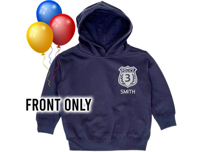 Navy blue hoodie with silver police badge that contains the number '3' as a placeholder for child's age. The name 'Smith' is underneath also as a placeholder for the child's name.