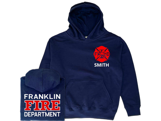 Navy blue hooded sweatshirt in youth sizes with red Maltese Cross on the front. The youth's name is under the Maltese Cross. The hoodie has a large front pocket for both hands. A folded sweatshirt shows the back with a custom fire department name and "Fire" and "Department" underneath.