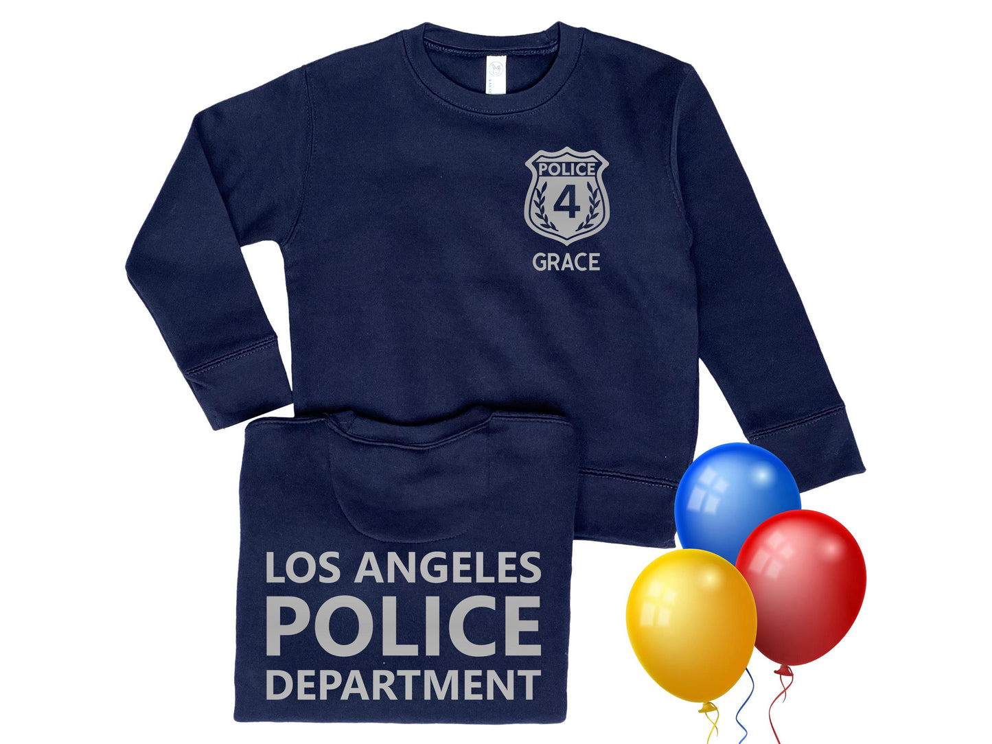 A navy blue toddler sweatshirt with a silver police badge on the front that says 'Police' and '4' with the name 'Grace' underneath. The back of the sweatshirt says 'Los Angeles Police Department' in silver. Three colorful balloons represent a birthday theme.