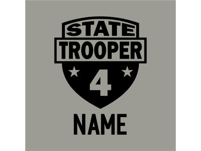 Closeup view of badge graphic design with the text 'STATE TROOPER' and the number '4' in a shield shape. The text 'NAME' is below the shield in black text, on a gray background.