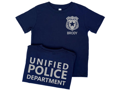 Navy blue kids police t-shirt featuring a silver police badge with personalized name underneath. Back displays custom Police Department name in silver text.