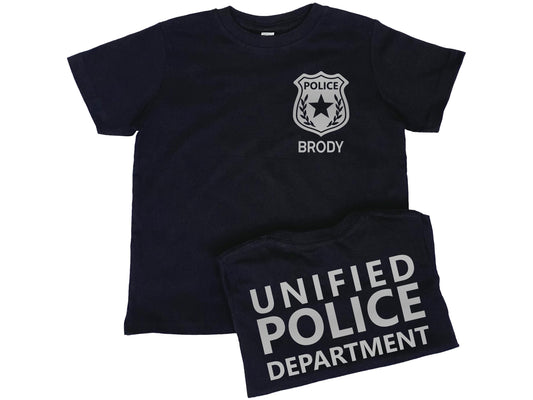 Black short sleeve t-shirt with silver police badge on left chest and the name 'Brody' underneath in silver text. Shirt back has 'Unified Police Department' in silver text.